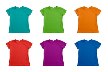 Set of bright stylish t-shirts on white background, top view