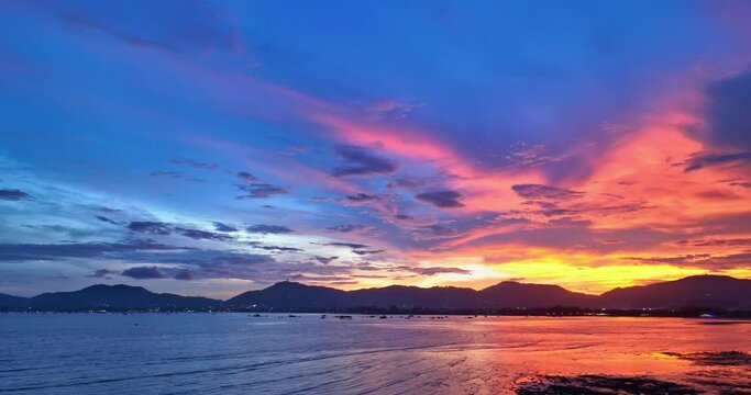 
aerial view reflection of colorful cloud in bright sky of sunset above the ocean at Khao Khad Phuket. 
Majestic sunset or sunrise landscape Amazing light of nature background. 
fantastic sky texture.