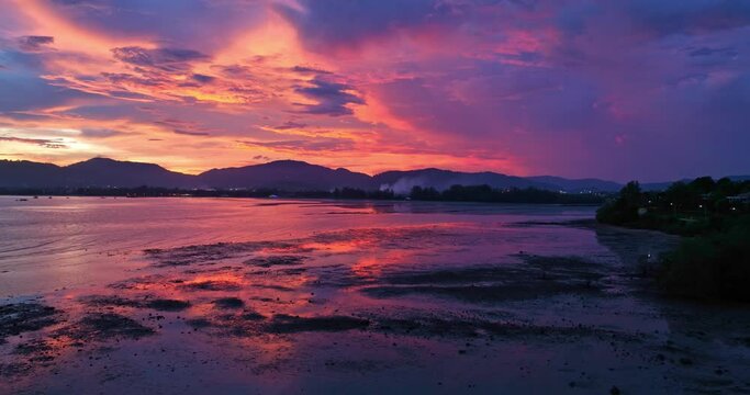
aerial view reflection of colorful cloud in bright sky of sunset above the ocean at Khao Khad Phuket. 
Majestic sunset or sunrise landscape Amazing light of nature background. 
fantastic sky texture.