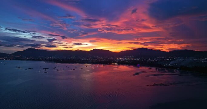 
aerial view reflection of colorful cloud in bright sky of sunset above the ocean at Khao Khad Phuket. 
Majestic sunset or sunrise landscape Amazing light of nature background. 
fantastic sky texture.