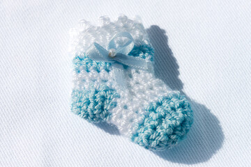 Crochet baby clothes as souvenirs for a first year birthday party