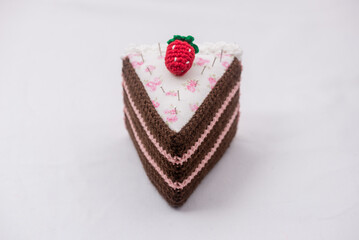 Chocolate and raspberry cake pincushion with a strawberry on top