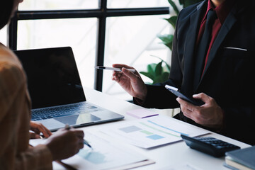 Cropped shot of professional business team working and discussing their recent financial project in the office room.
