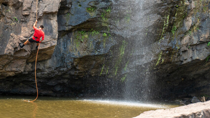 Mountain climbing over a waterfall in Matagalpa, Nicaragua during a trip to Central America