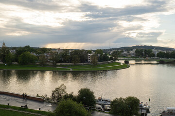 Dramatic sky above the Vistula river in Krakow Poland. Stunning views of the city rainy season and rainbow. Sky, panoramic views. 