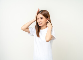 Woman stressed and frustrated covering her ears with her hands due to loud noise. Annoyed noise sound pollution. Asian Woman blocking ears
