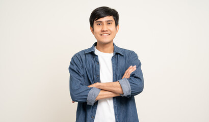 Handsome young man age around 25 smiling and happy. Charming male standing with on isolated white...