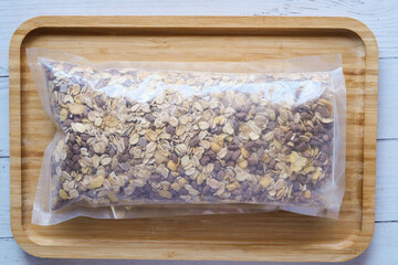 Obraz premium granola Musli in a plastic packet on table 