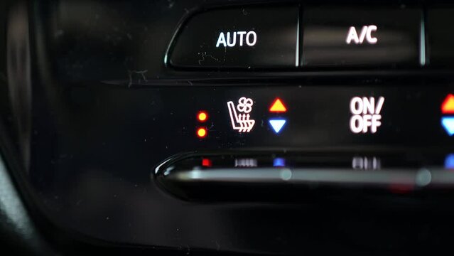 Using the Heated and Cooled Car Seats Option by Pressing the Button