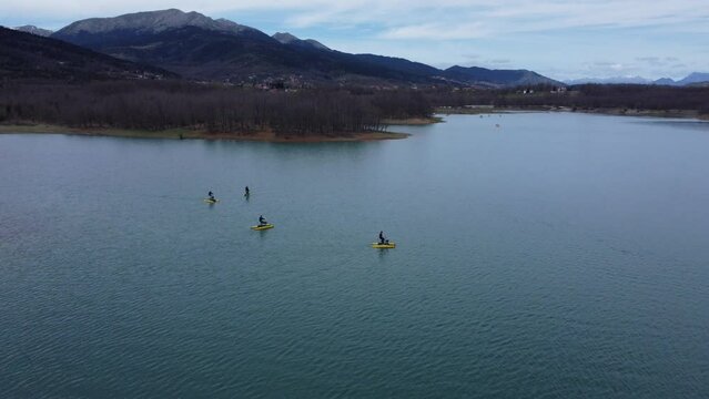 People riding water bikes. Aerial footage of hydrobikes in lake Plastira Greece | 4K