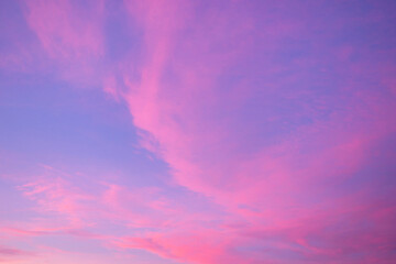 Beautiful pink clouds in the evening blue sky. Background, wallpaper.