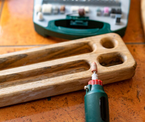 Naklejka premium box with accessories for processing and engraving next to an electric tool.