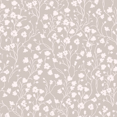 Spring floral pattern of light beige flowers and twigs on a beige background.