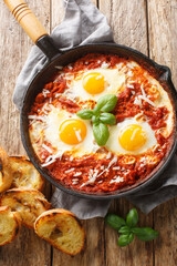 Eggs in Purgatory is an easy Italian dish served with lots of crusty bread for dipping closeup on...