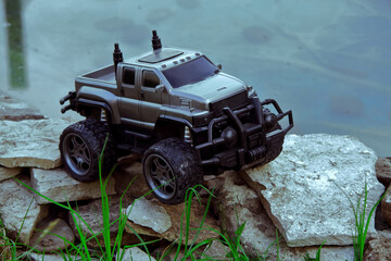 Radio-controlled children's car models. gray SUV truck, toys with remote control. Free time. A...