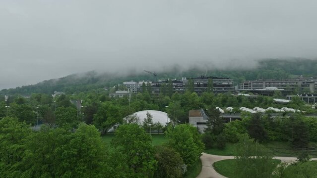 Aerial view of City of Z&uuml;rich with University Campus Irchel on a cloudy spring morning. Movie shot May 9th, 2023, Zurich, Switzerland.