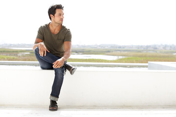 Thinking, relax and a man with fashion in nature for calm, peace and planning in Costa Rica. Serious, think and a handsome person with an idea, plan or ideas while relaxing in a natural environment