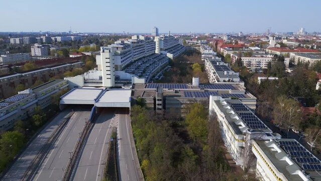 empty freeway goes through tunnel house. Breathtaking aerial top view flight 
highway house in Berlin City district Steglitz Germany spring 2023. boom sliding to right drone
4k uhd cinematic footage.