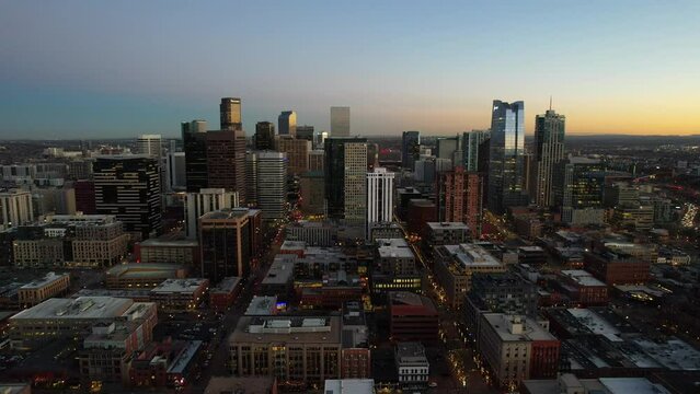 Aerial over the Denver skyline at dusk, Colorado, USA. Drone dolly forward shot