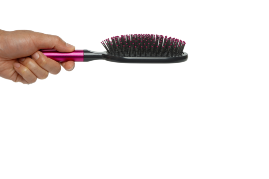 Human hand holding a comb with hair loss isolated on white background,Health care and medical, Hair loss problem concept.
