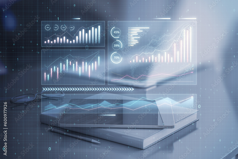 Poster close up of tablet and book places on desktop with abstract glowing candlestick business chart on bl