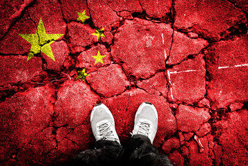 Exposure of China flag with cracked stone background. It tells about the sovereignty war between Taiwan and China. The United States supports Taiwan behind the scenes.