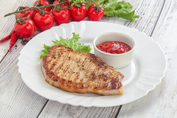 Grilled pork steak with ketchup