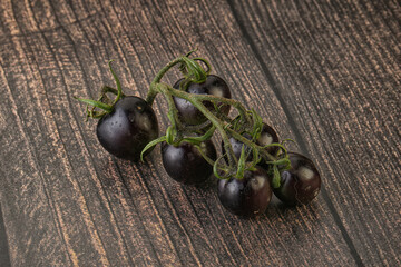 Ripe tasty black cherry tomato
