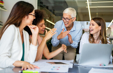 Fototapeta premium Group of successful happy multiethnic business people working as a team in office on meeting.