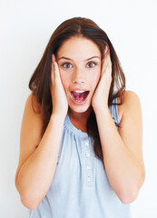 Portrait, surprise and shocked woman in studio isolated on a white background. Wow, omg and face of female person with surprised expression, emoji and unexpected news, announcement or secret gossip.