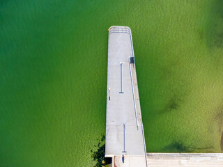 Aerial view landscape Poland Gdynia city boulevard. Green water, Baltic sea, concrete pier.