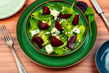 Salad with beet, blue cheese and pine nuts