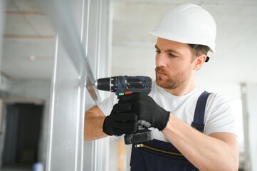 man fasten metal profile frame to the wall for draywall bulkhead