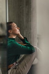 Young sad woman in office, having problem.