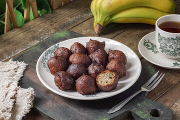 Malaysian fritter snack deep fried banana balls or Malay as Cekodok Pisang