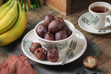 Malaysian fritter snack deep fried banana balls or Malay as Cekodok Pisang