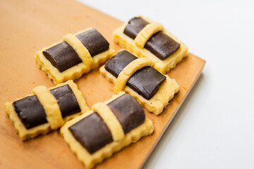 Cookies with chocolate topping. Very popular for Eid and other special moments. Isolated background in white