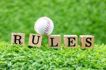 Baseball with Rules on green grass