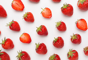 Strawberries with leaves on white background, top view