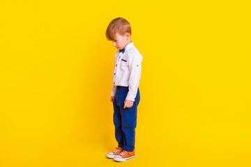 Profile side full body photo of disappointed abuse kid standing guilty punished isolated bright color background