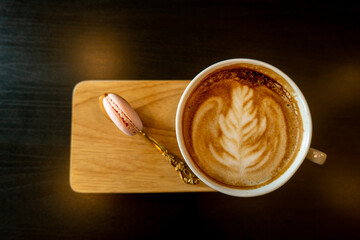 cup of coffee with a heart painted in a white cup on wooden background, Coffee time concept, Coffee break time.