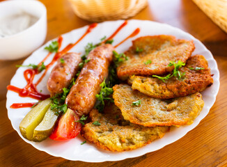 belarusian pancakes with sausages in a restaurant