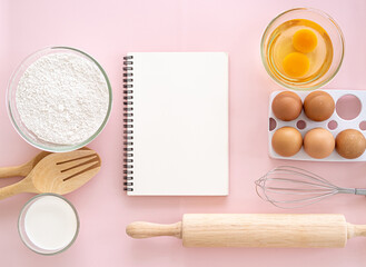 Blank notepad on a white background. Culinary cooking baking concept, place for a recipe. Top view.