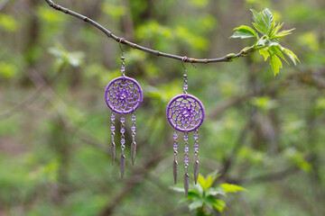 earrings of Handmade dream catcher with feathers threads and beads rope hanging