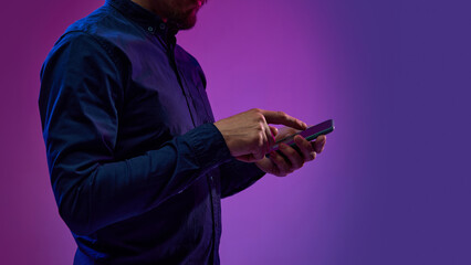 Fototapeta premium Businessman working with mobile phone, using online services for business. Innovations, impact of global digitalization. Concept of business, modern technologies, network, internet, gadgets