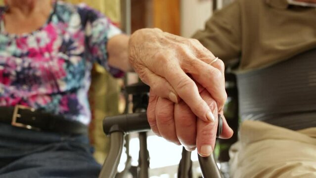 seniors who love each other hold hands