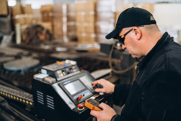 operator controls plasma for cutting metal