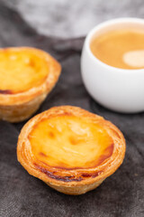 Egg tart, traditional Portuguese dessert, pastel de nata and coffee