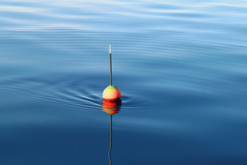 Fishing float on calm water surface. Generative art
