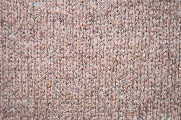Handmade knitted material with detail woven threads.